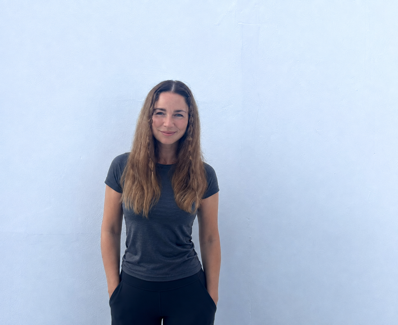 Jessica Bendahan, certified personal trainer, standing in a modern gym studio